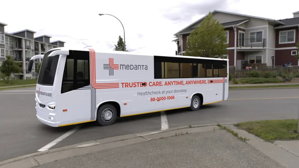 Medanta Seva Setu: white Medanta bus on a street, daylight