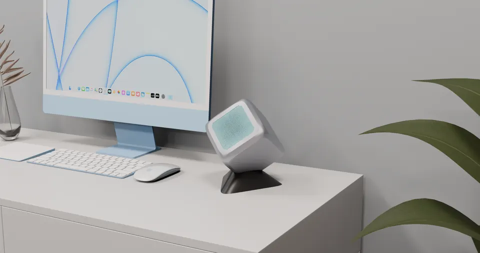 OpenHome: mint speaker on a stand beside a blue iMac
