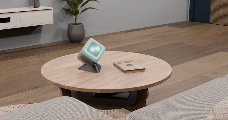 OpenHome: mint speaker on a round timber table